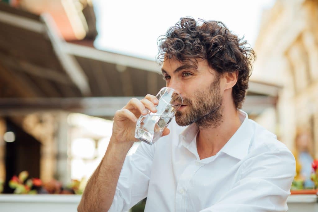 Portrait,Of,A,Young,And,Masculine,Man,Drinking,A,Water